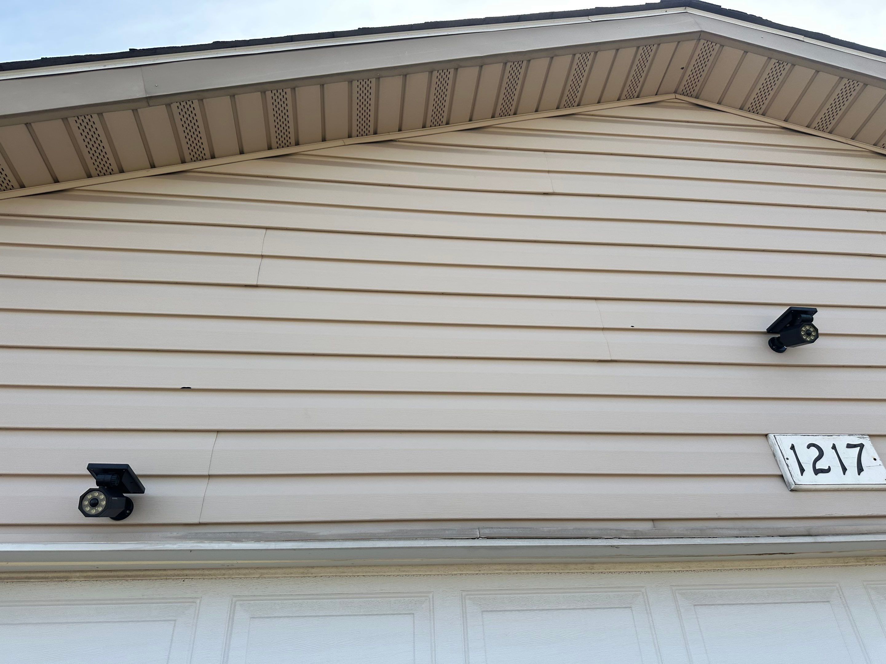 Mocha Lap Siding Installation for St. Louis Residential Exterior by Acute Roofing And Exteriors