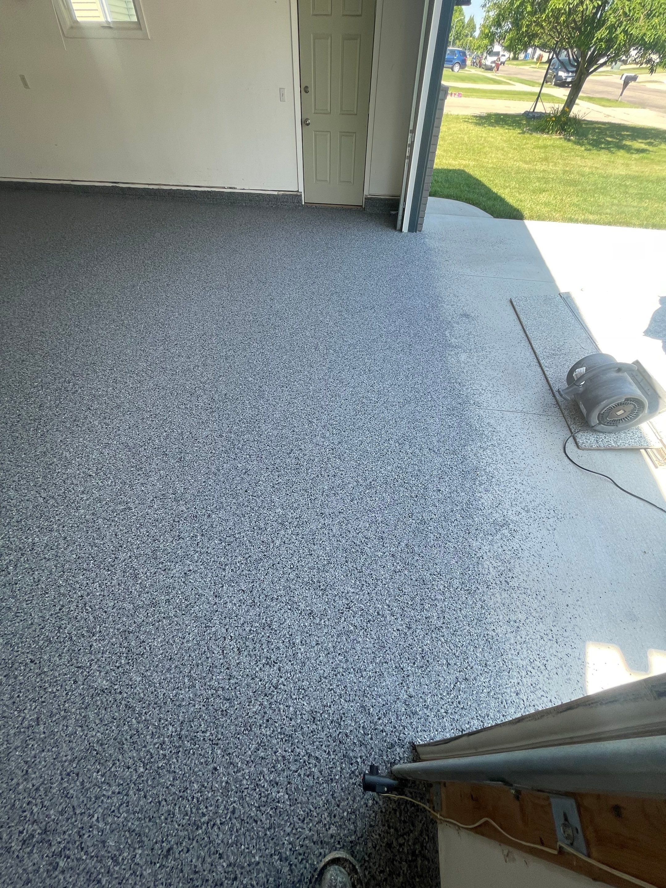 Sioux Falls Garage Floor Coating with Nightfall Decorative Chips by Select Painting, Coatings & Garage Cabinets