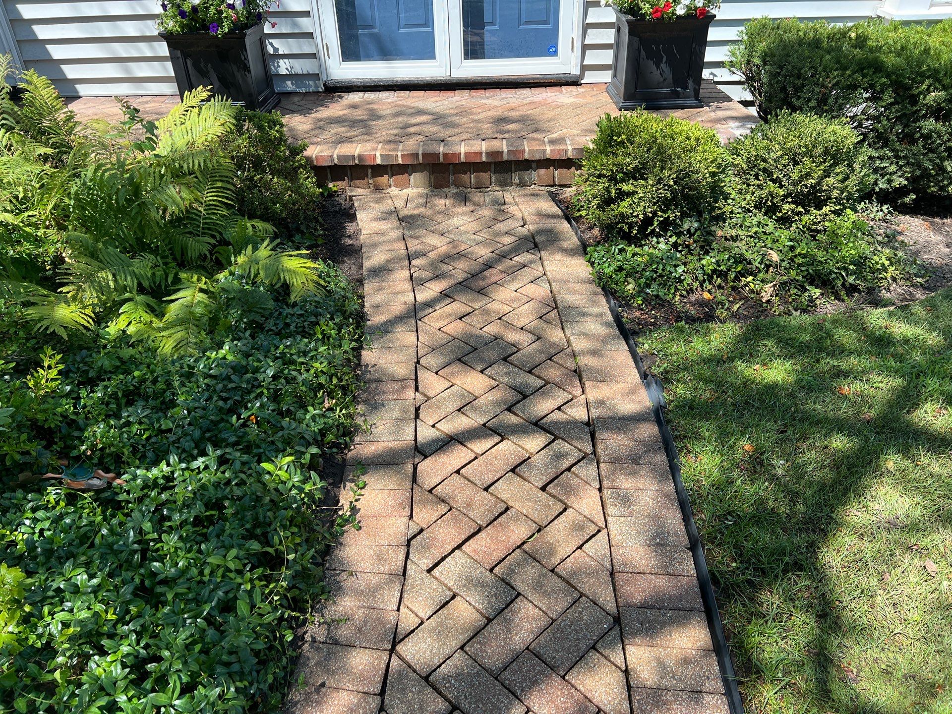Brick paver clean, sand and seal.  using Polysweep polymeric sand by Northern Power Washing LLC.