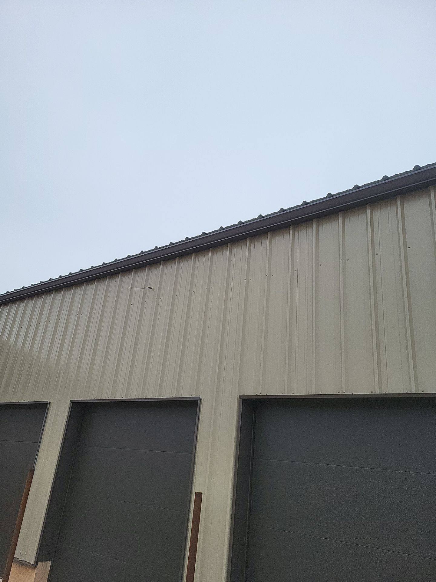 Metal Shop 6" Gutters & Downspouts Install - Color Musket Brown  by Titan Commercial & Residential Roofing 