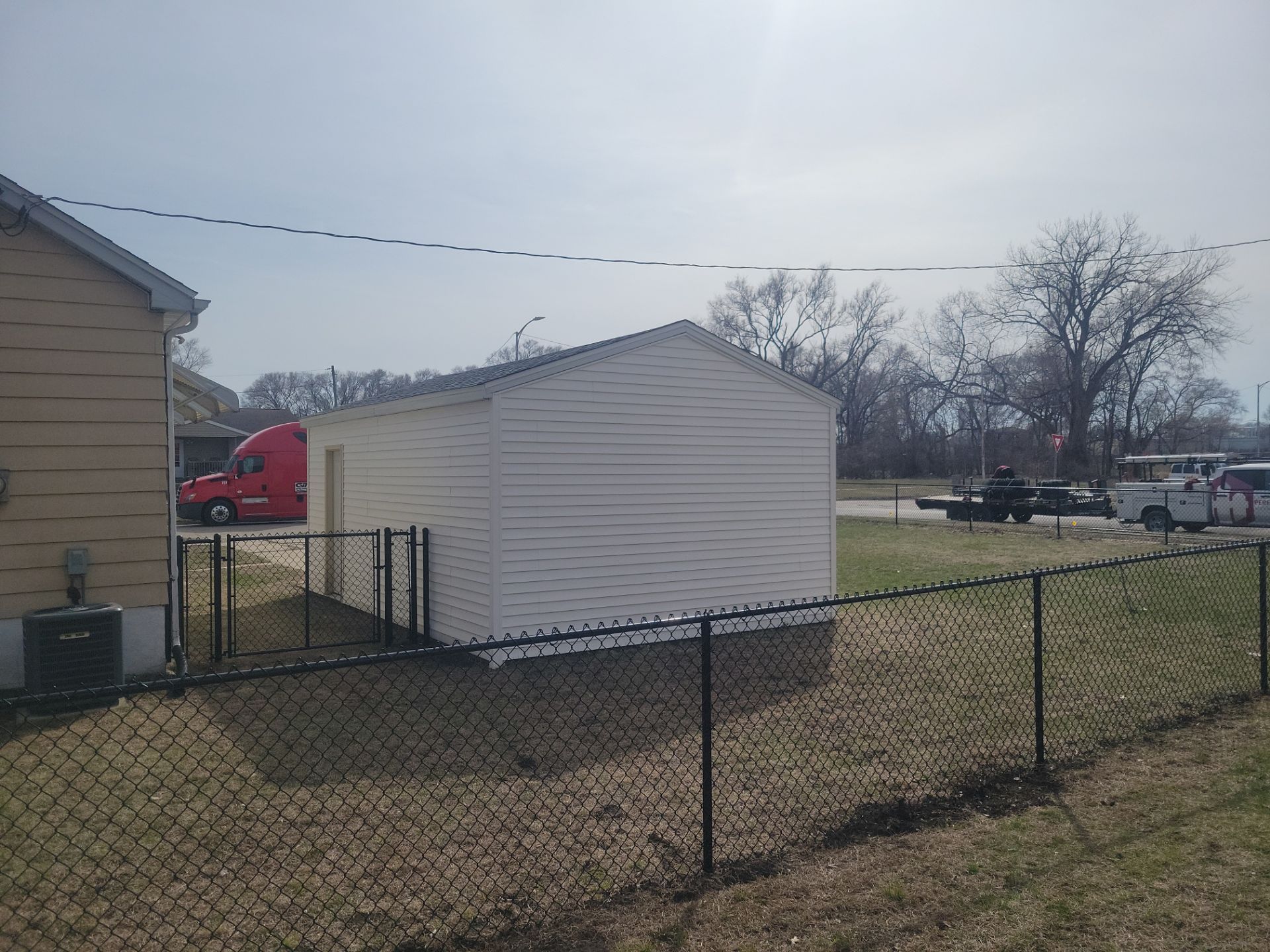 Black Chain Link Fence and Gate Installation in Waterloo by Perfect Picket Fence and Stain