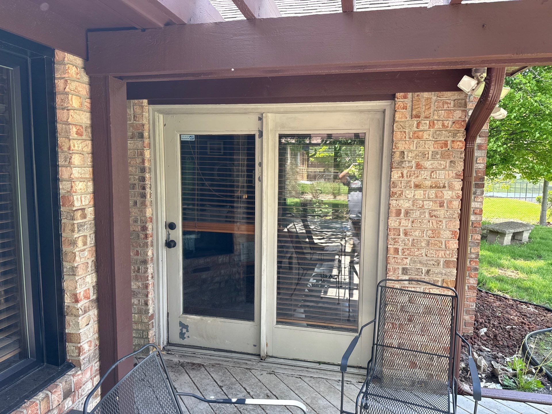 Black Sliding Patio Door Installation in New Palestine by Merrifield Exteriors, LLC
