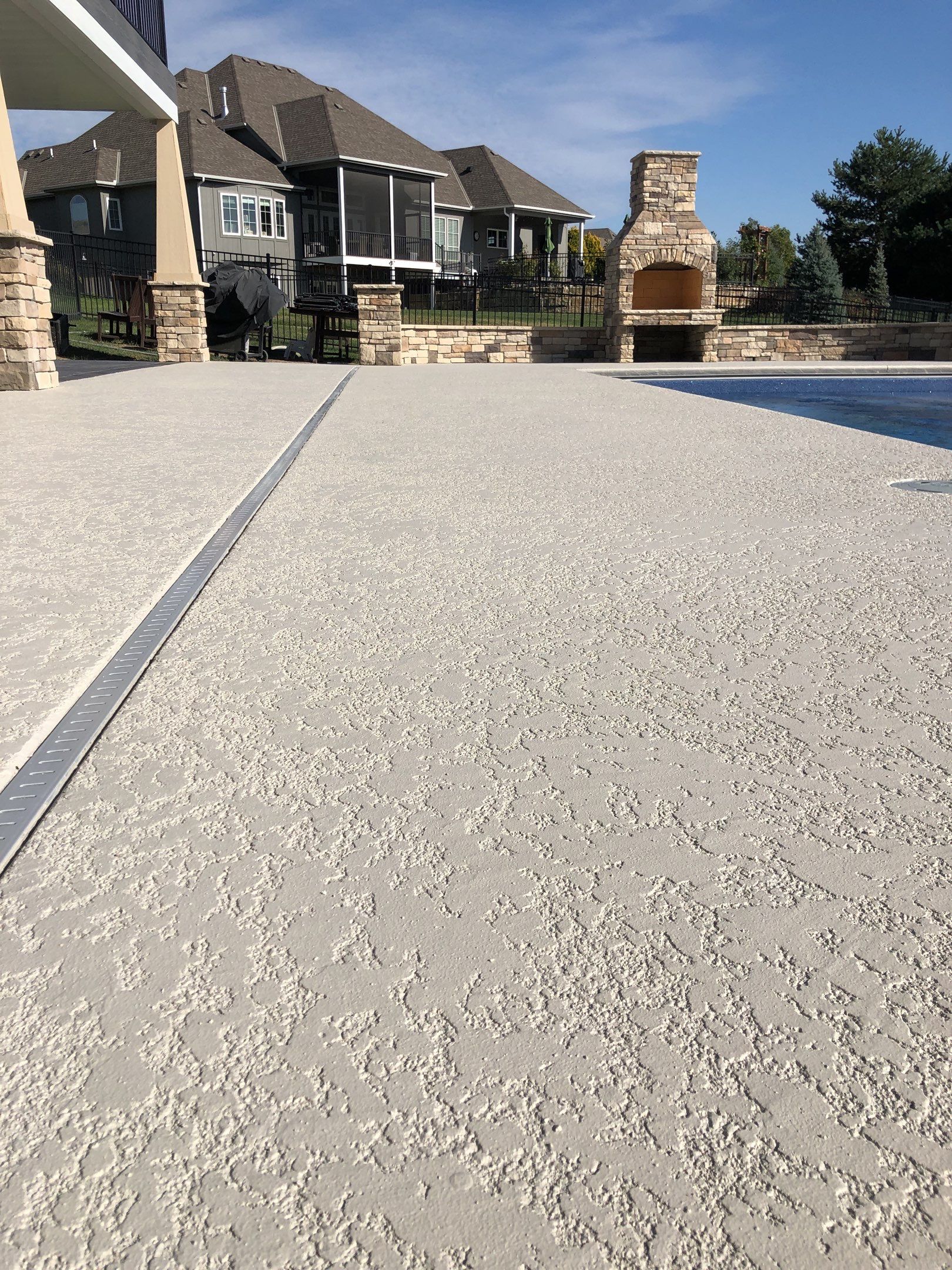 Parkville, MO -- Pool Deck Coating with Classic Texture (knockdown) finish by Big Red Decorative Concrete, LLC