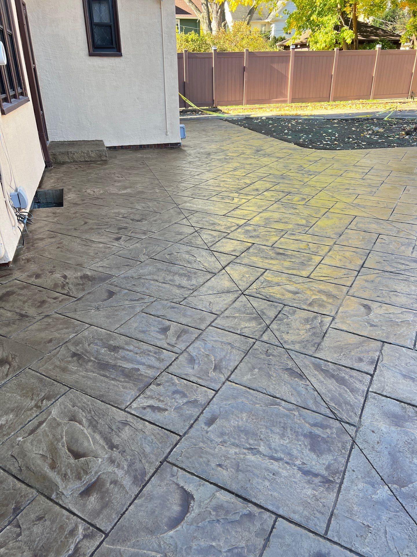 Majestic Ashlar stamped concrete patio  by NG Masonry & Construction LLC