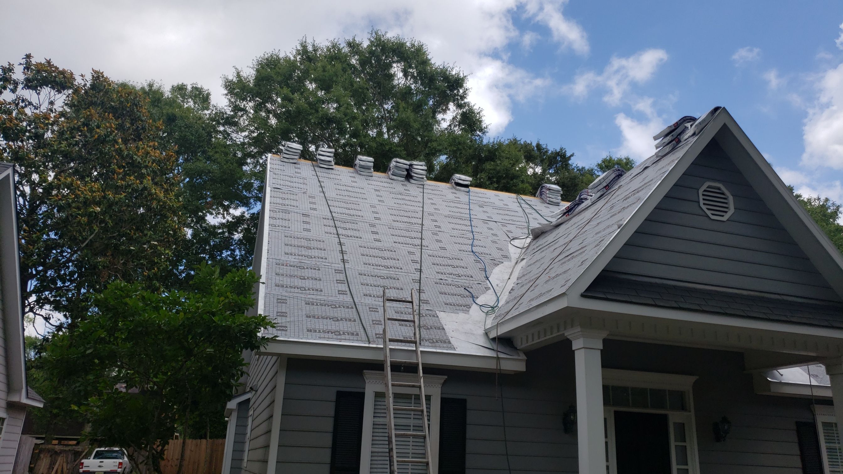 Residential Roofing Installation using Roof Replacement by American Roofing & Construction LLC