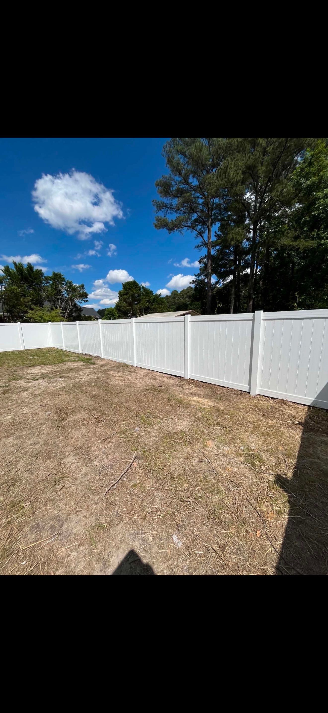 White Vinyl Privacy Fence with Solar Post Caps in Goldsboro by Superior Fence and Rail