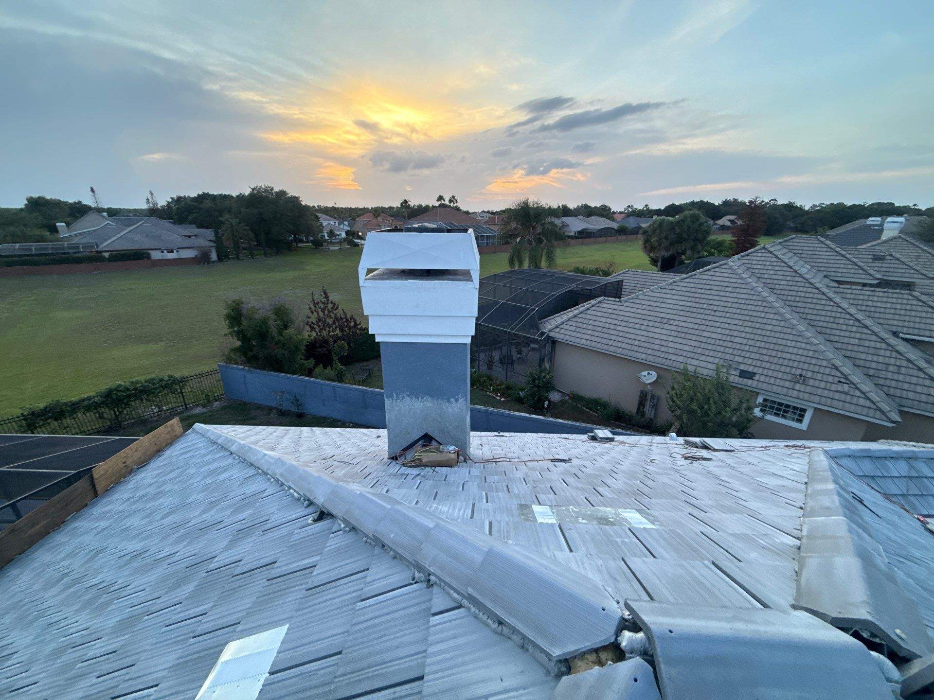 Winter Park Concrete Tile Roof Replacement and Chimney Flashing Installation by Fortified Roofing Solutions Corp.