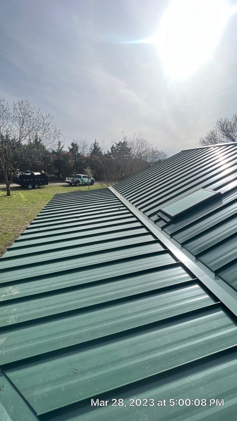 Shingle to Standing Seam Metal Roof by Springtree Restoration 