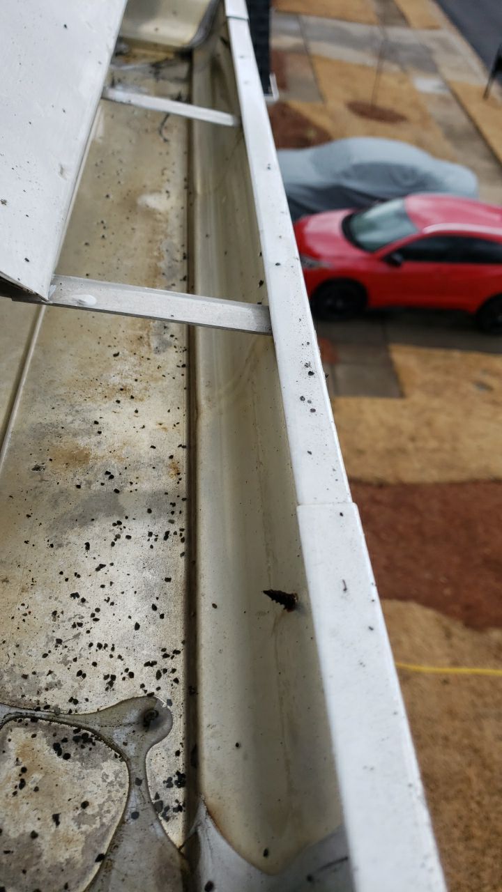 Gutter Cleaning using water by Power Wash Masters LLC