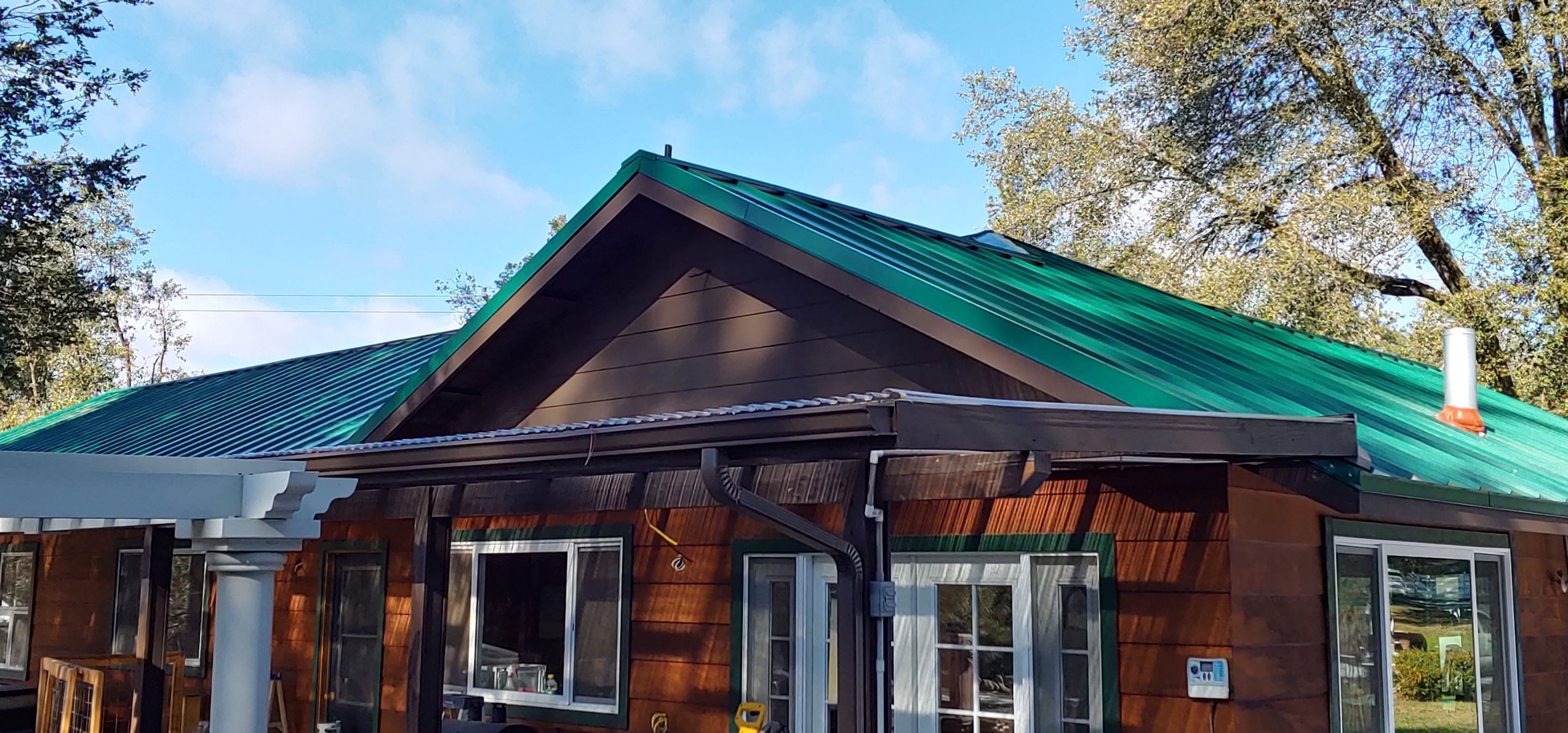 Metal roofing installation using Standing seam metal roofing system by Straight Edge Roofing Inc