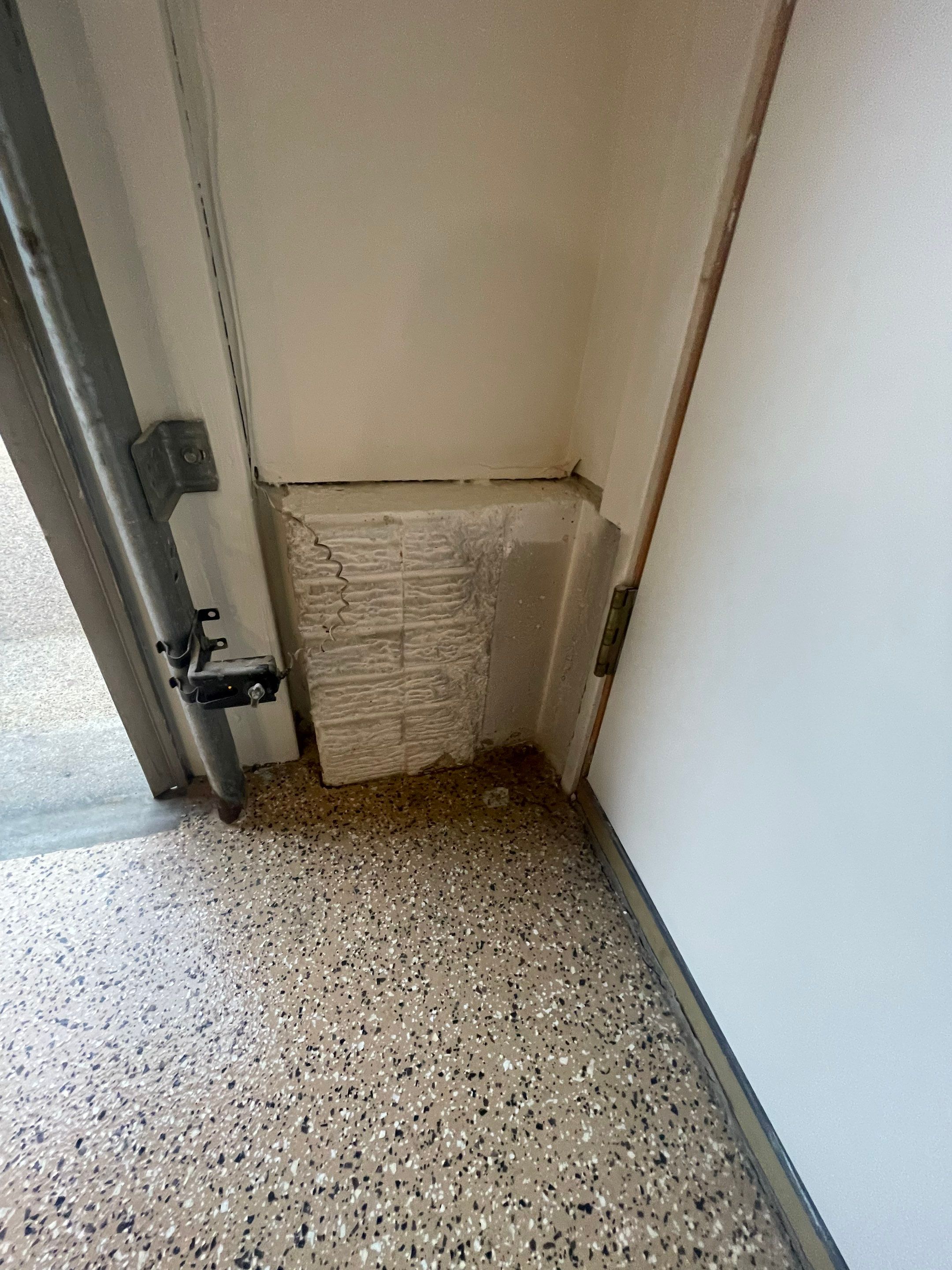 Gray Speckled Epoxy Garage Floor Coating in Sioux Falls by Select Painting, Coatings & Garage Cabinets
