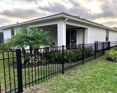 Aluminum Fence Installation using Black 3 Rail Aluminum Fence