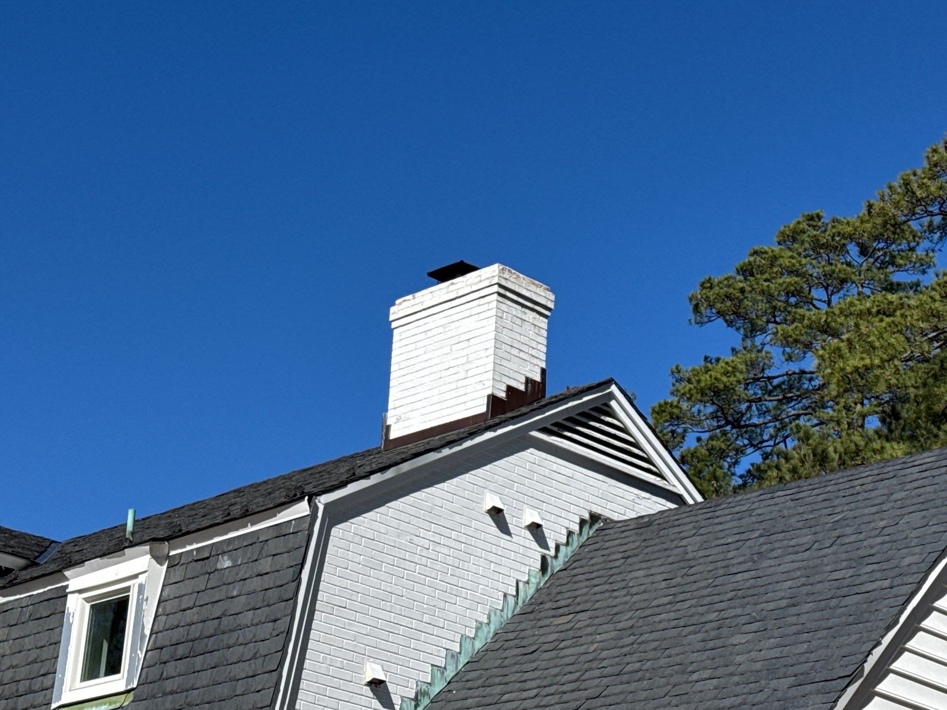 Historical Slate Roof Repair and Chimney Flashing Restoration in West Point by Cade Construction