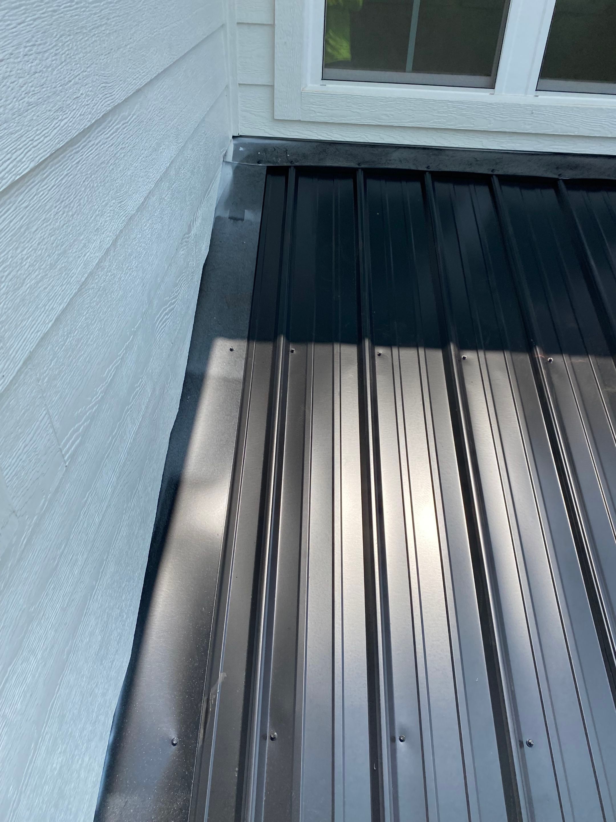 Jason's metal porch roof by BROCK BUILDERS 