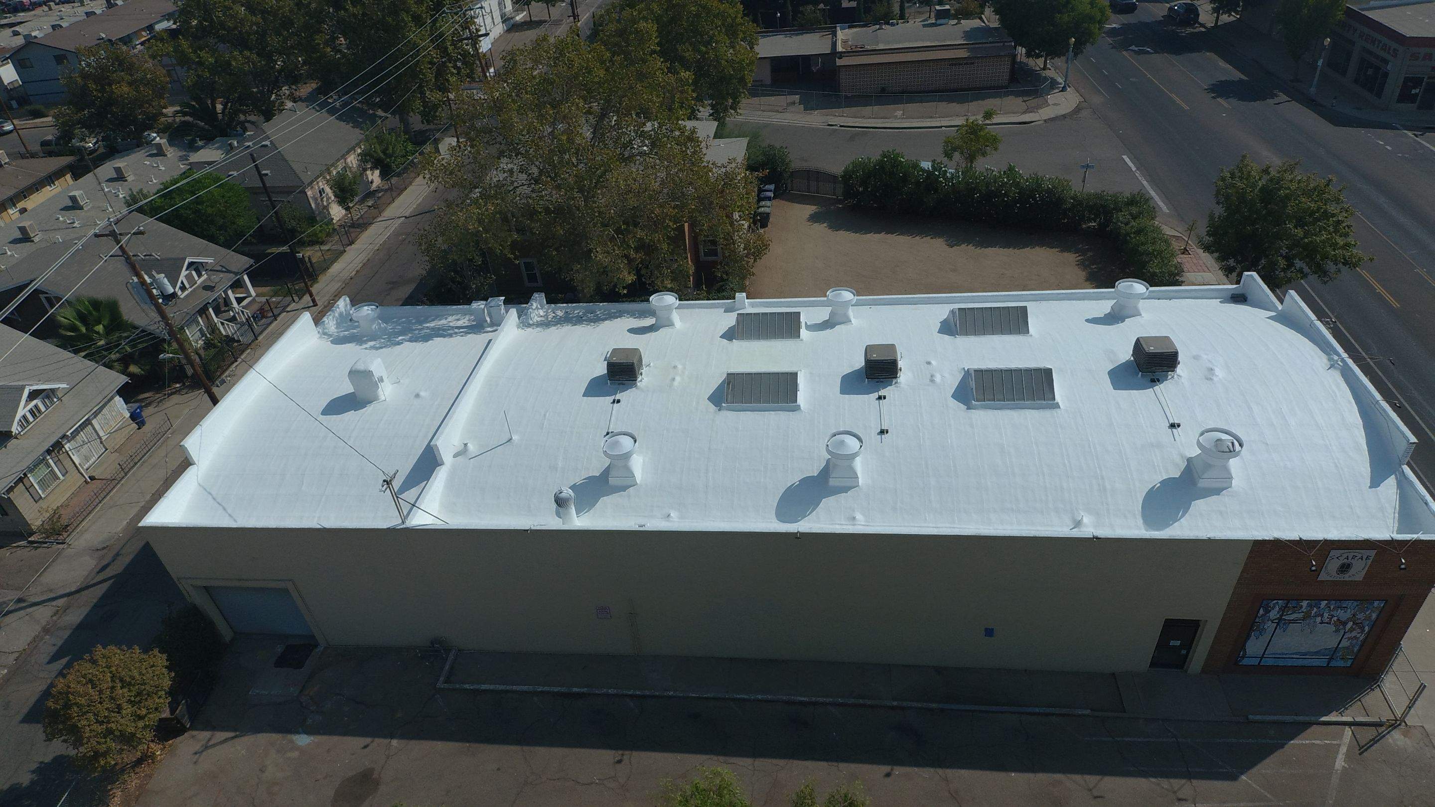 Polyurethane foam roof refurbish and recoating by Straight Edge Roofing Inc