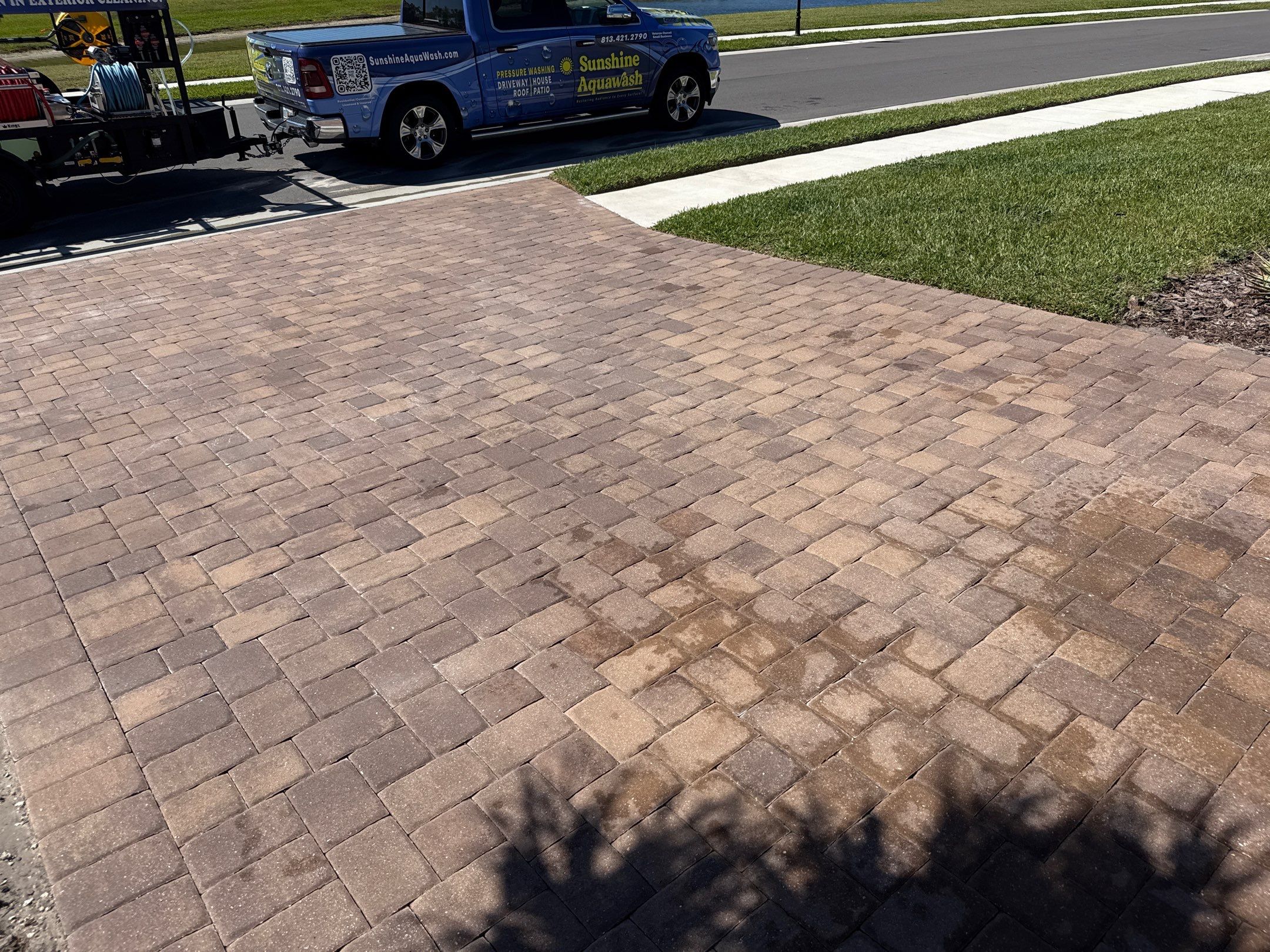 Oil Stain Removal on Paver Driveway | Esplanade at Artisan Lakes, Palmetto FL by Sunshine AquaWash