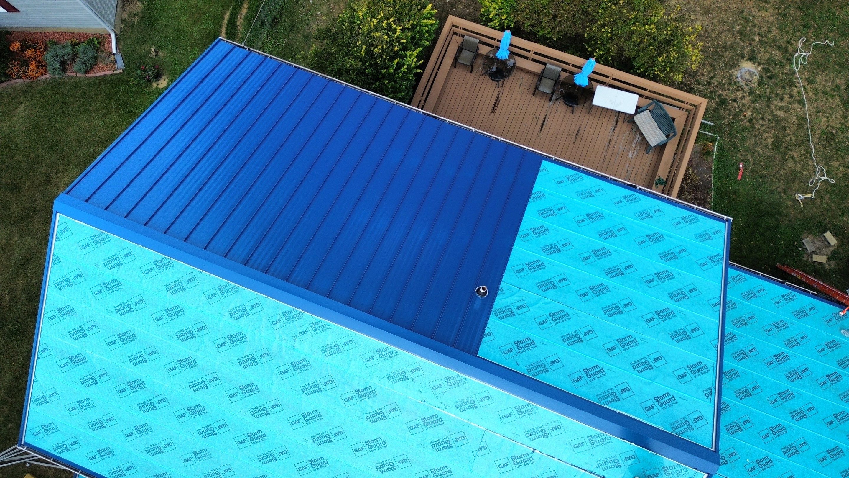 Residential Roofing Installation using Standing Seam Metal - Gallary Blue by RoofX 
