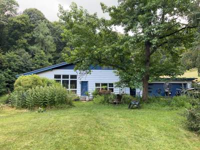 Two-Tone Siding and Sunroom Exterior Remodel in Beaver Falls
