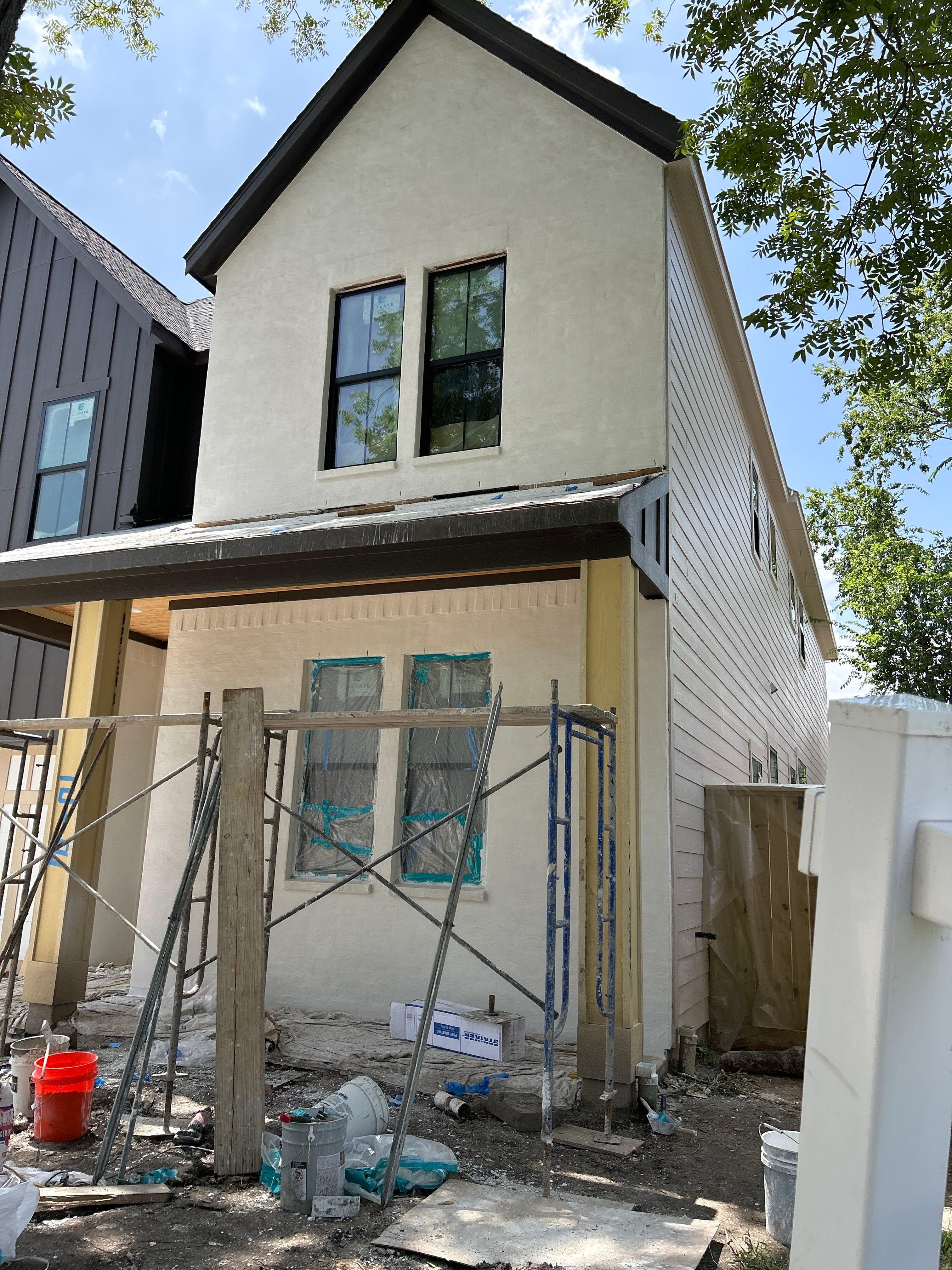 Midtown Elegance: Brickwork with Slurry Finish Refinement by Apex Conventional Stucco Llc