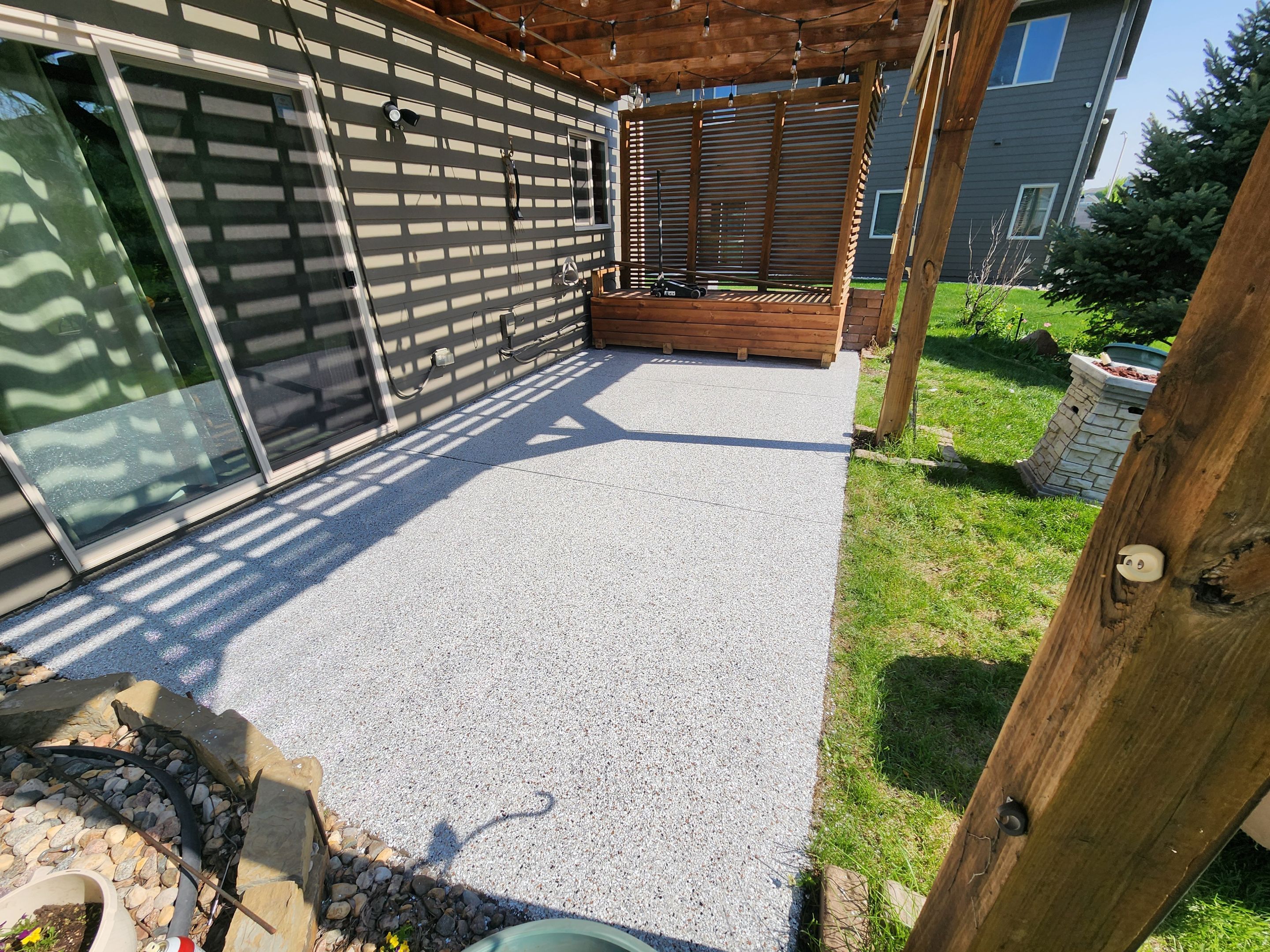 Coyote Flake Concrete Coating for Sioux Falls Patio by Select Painting, Coatings & Garage Cabinets