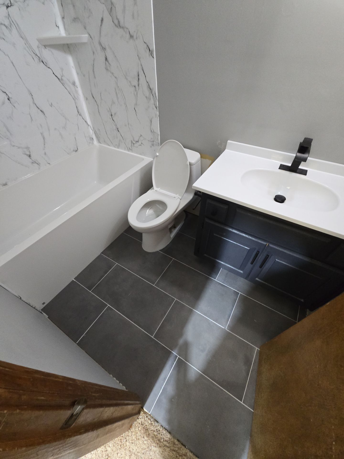 New bathtub and flooring by The Shower Company