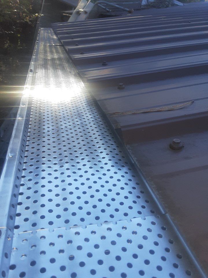 Gutter Installation using Royal Brown K-Style Seamless Gutters and LeafBlaster Pro Gutter Guards by Gutter Professors