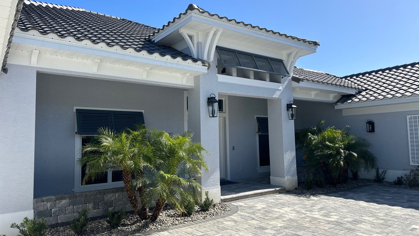 Bahama Shutters in Blue Grey by Smart Guard Shutters