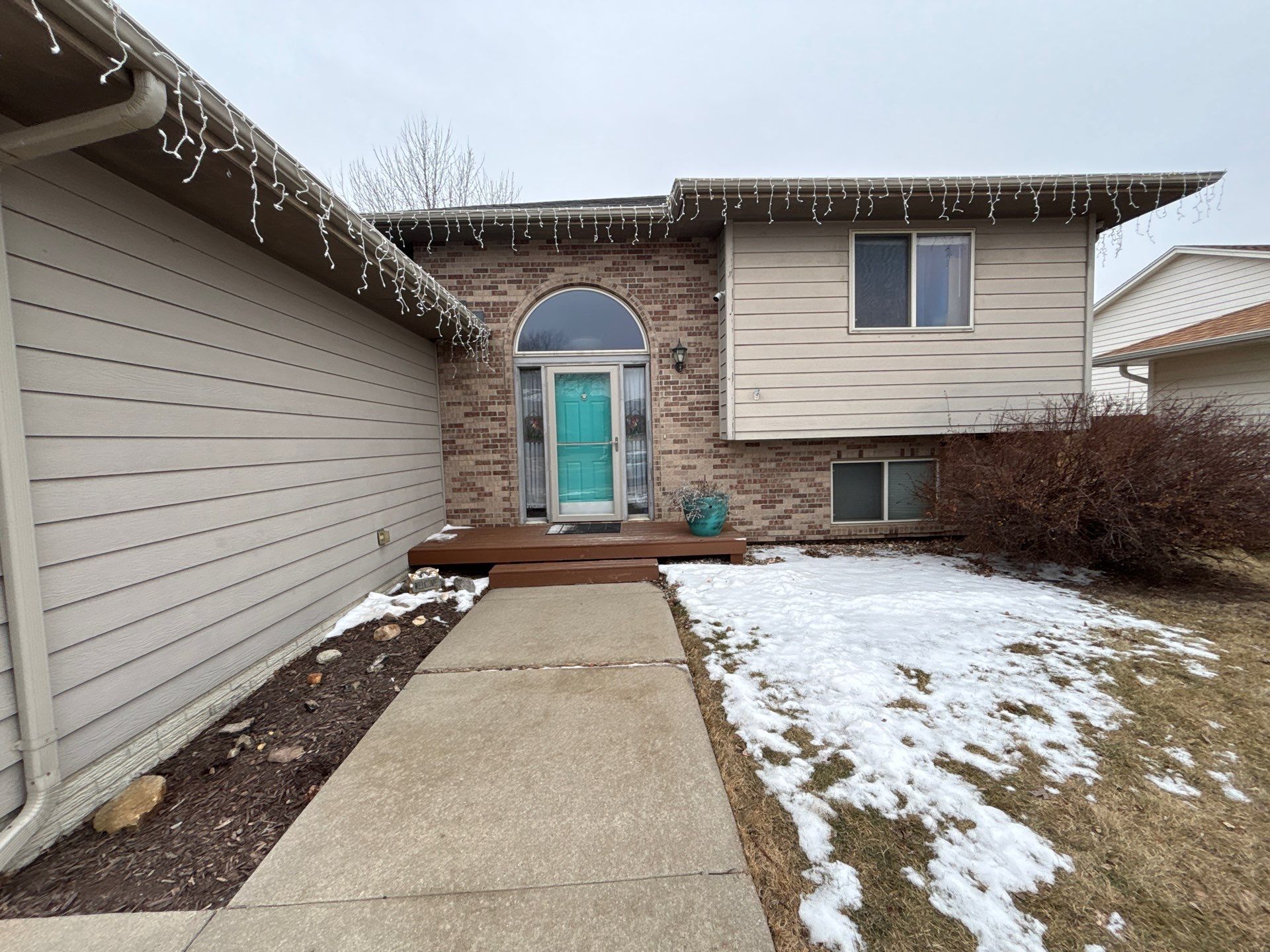 Exterior Painting and Wood Trim Replacement in Sioux Falls by Select Painting, Coatings & Garage Cabinets