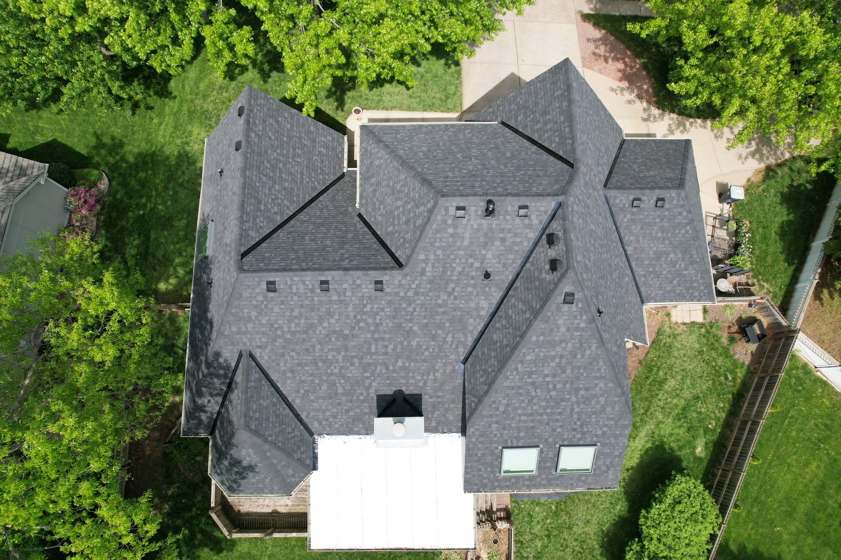 Comprehensive Roof Replacement and Skylight Installation in Kansas City by Liberty Roofing