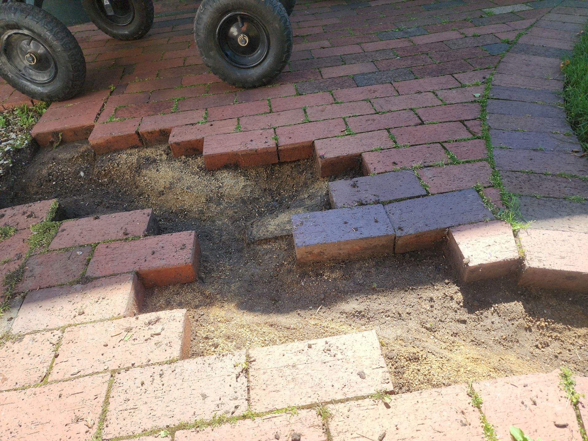 Brick paver repair, cleaning and sealing by Northern Power Washing LLC.