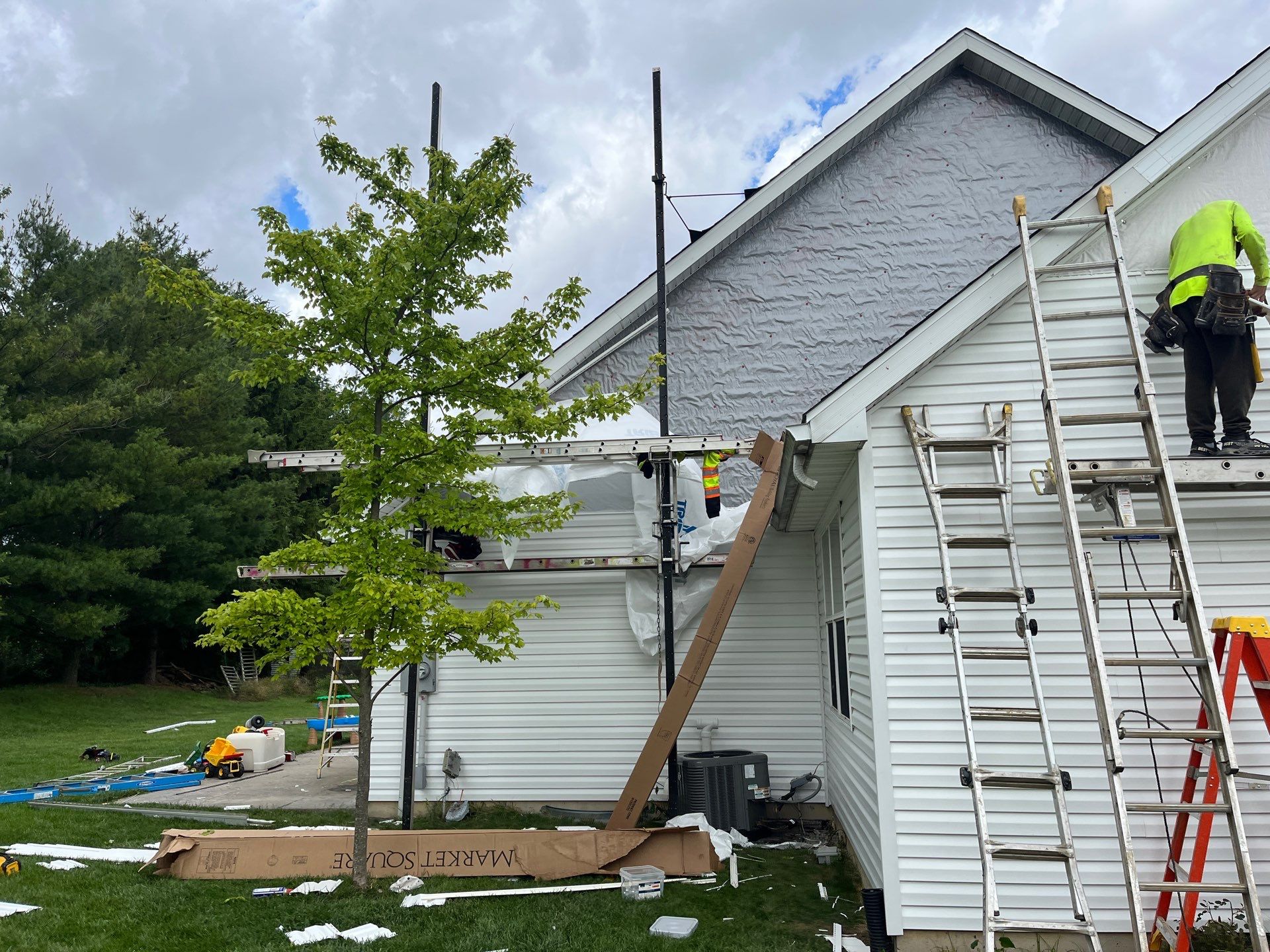 Exterior Installation using Onyx Black Durations and White Siding by WIW Enterprises Inc