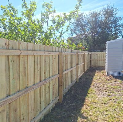 Wood Fence Installation using 6Ft Pressure Treated Wood Board On Board Privacy Fence