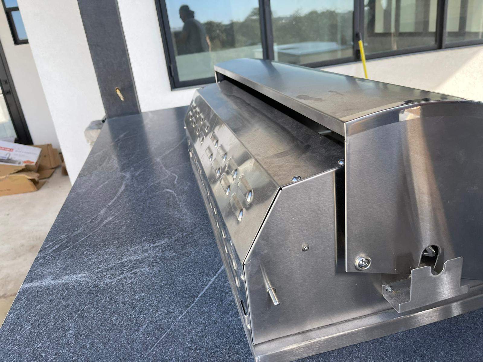Outdoor kitchen using Black mist honed granite by Mena stone surfaces
