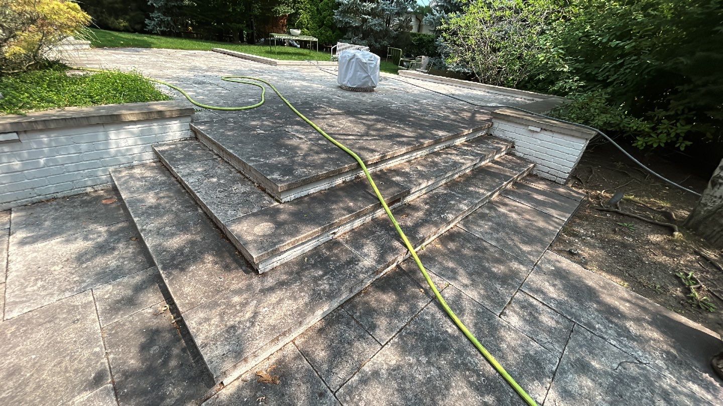 marble patio cleaning and sanding using Polysweep polymeric sand by Northern Power Washing LLC.