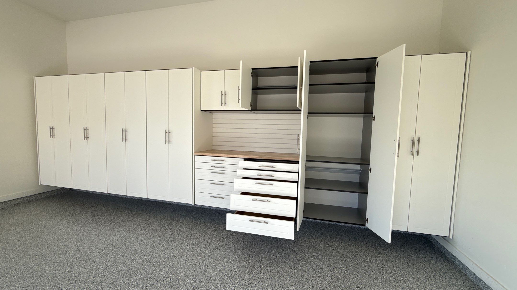 Garage Remodel with Custom Cabinets and Epoxy Floors in Overland Park by Banner Garage
