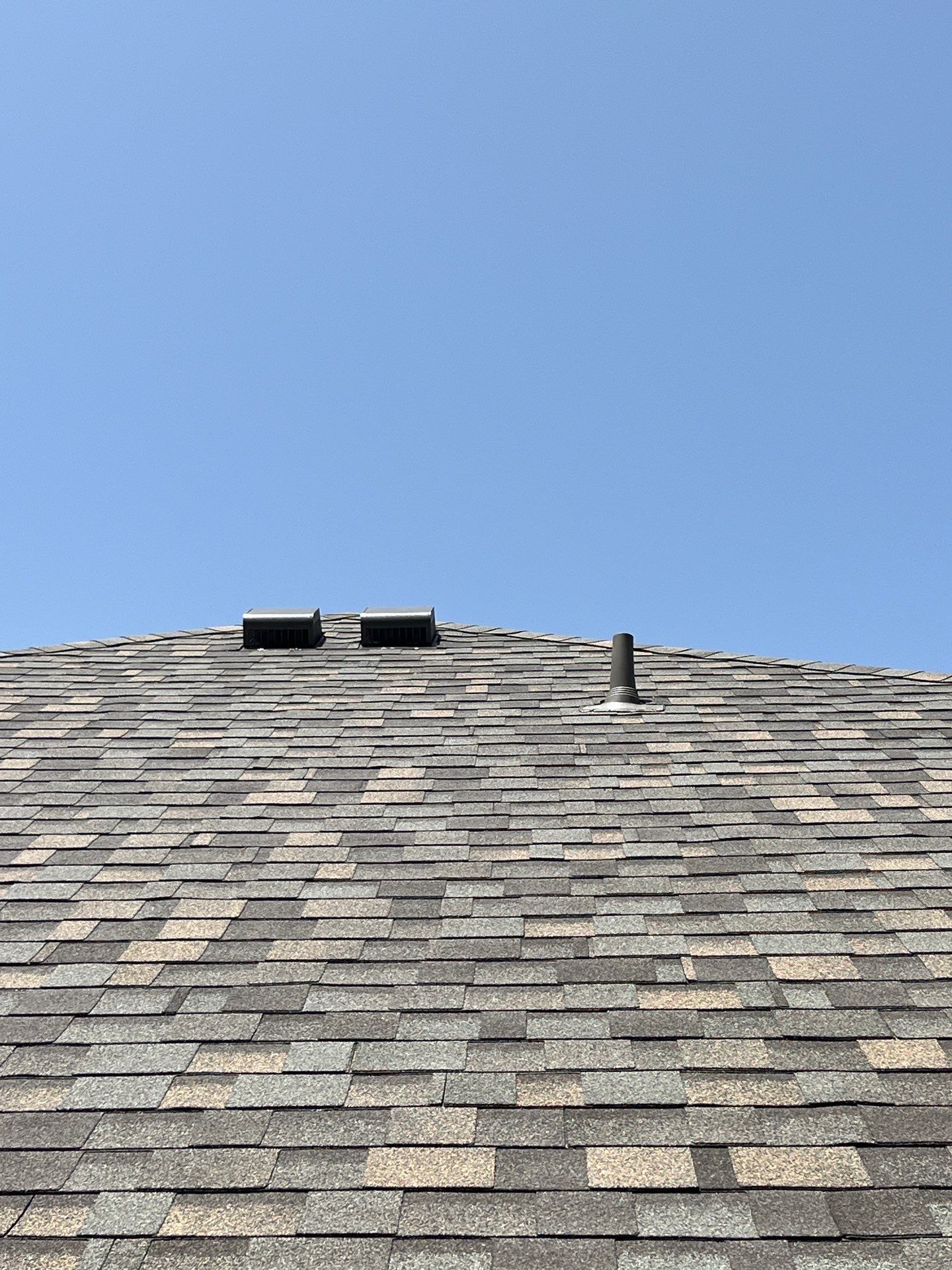 Red brick with IKO Cornerstone  by Tejas Roofworks + Restoration