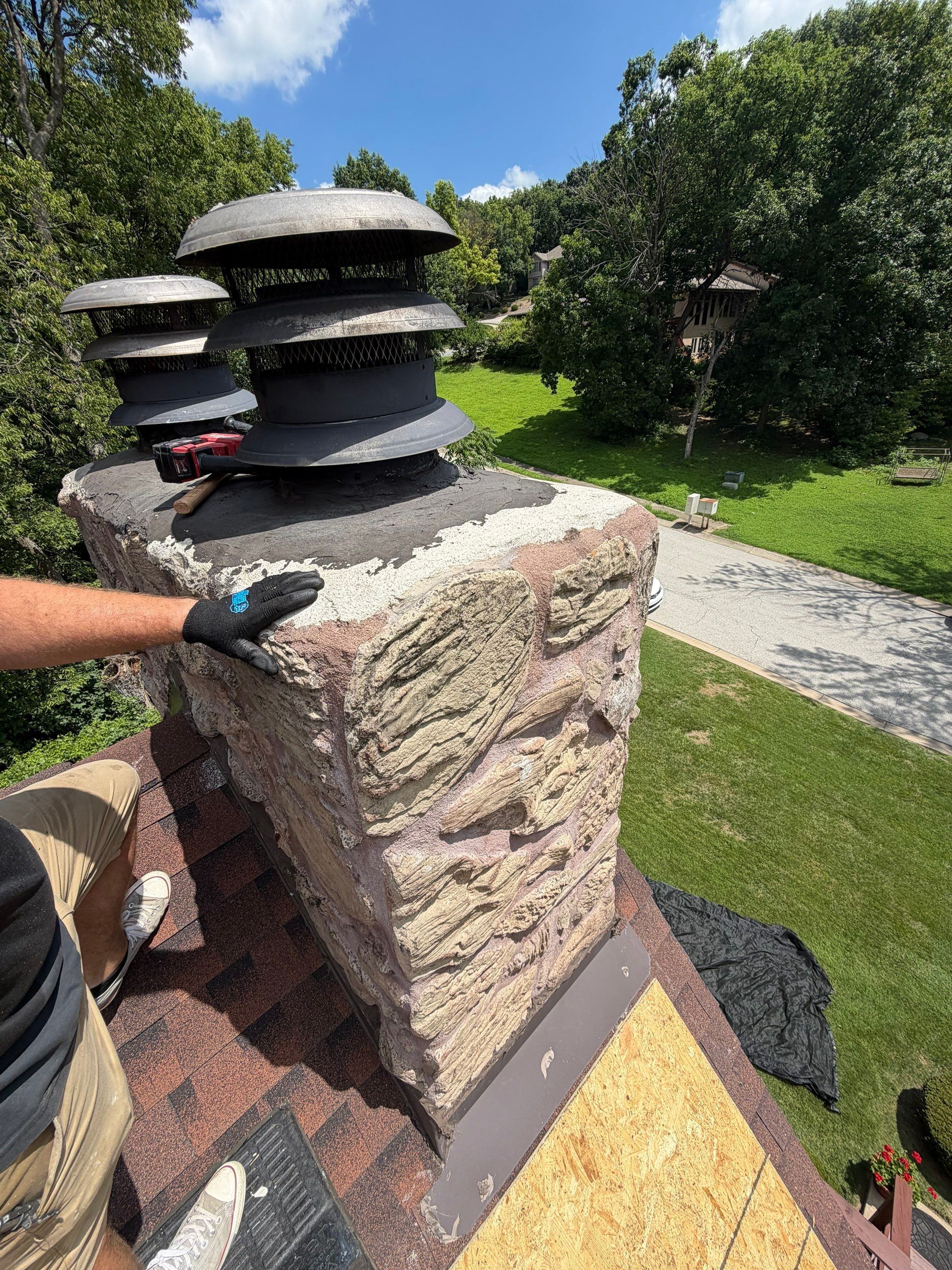 Structural Stone Chimney Restoration and Roof Repair in Leavenworth by Summit Roofing