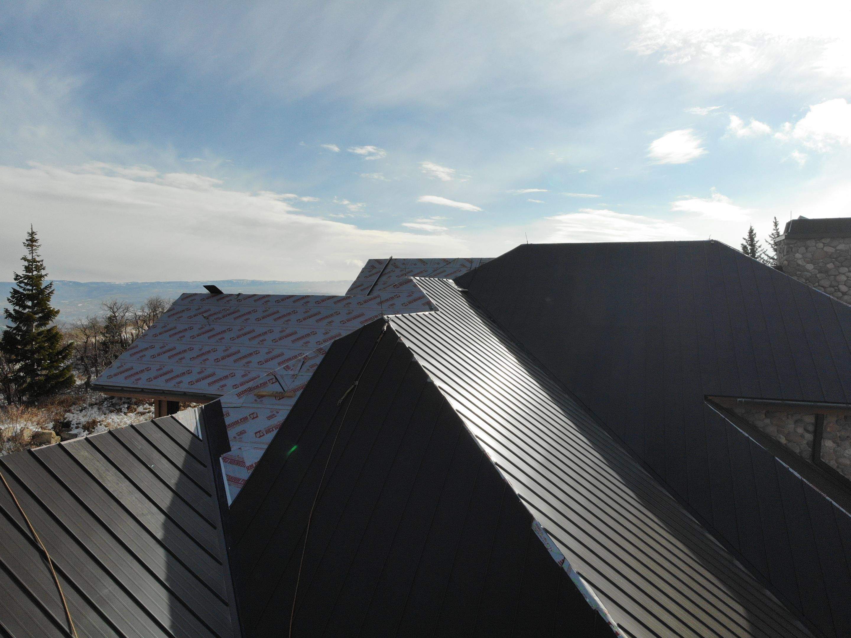 Standing Seam Metal Roof Replacement After Snow Damage by ASAP Roofing & Restoration