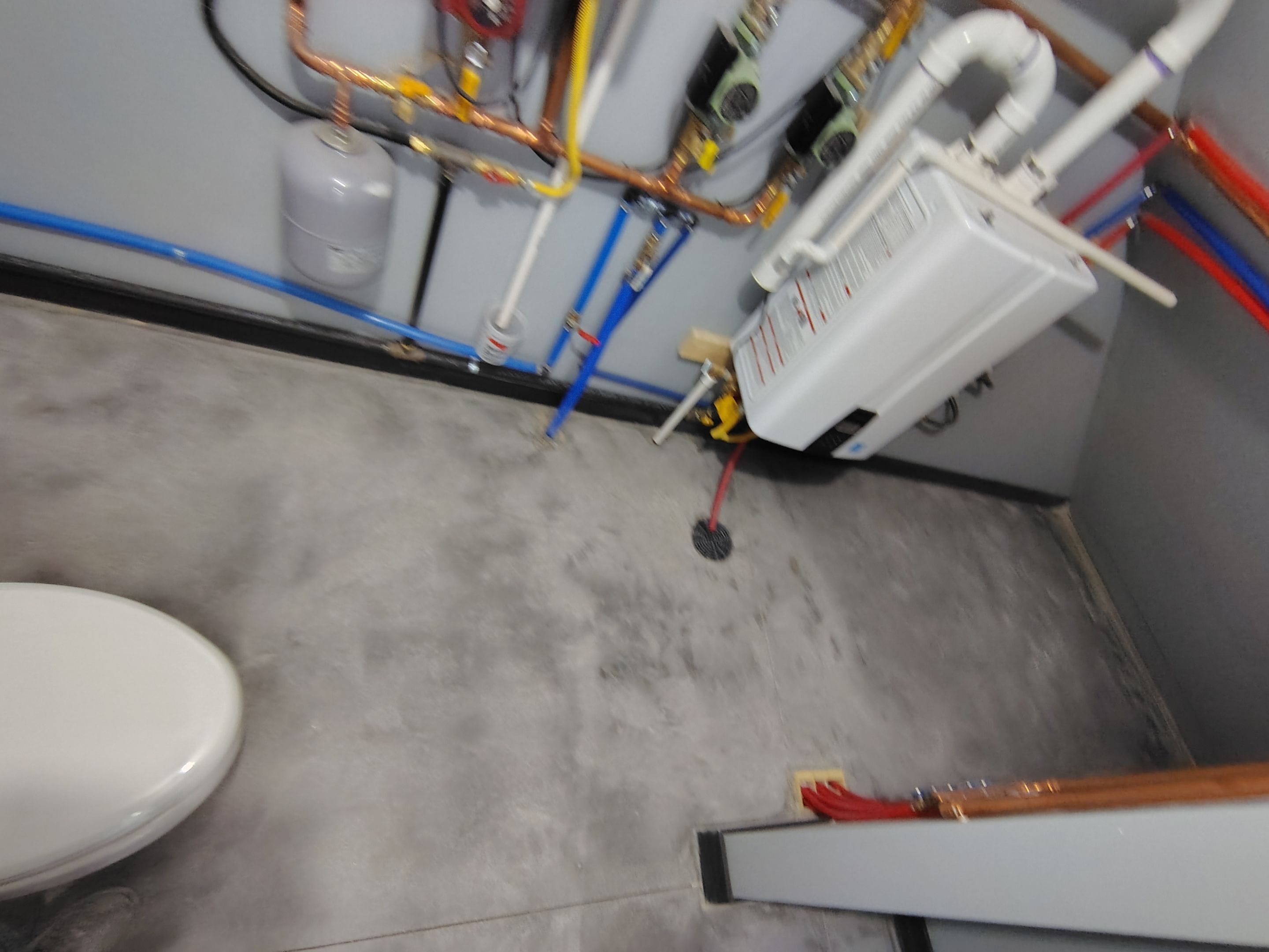 Polyaspartic Garage Floor Coating with Decorative Flake in Wentworth by Select Painting, Coatings & Garage Cabinets