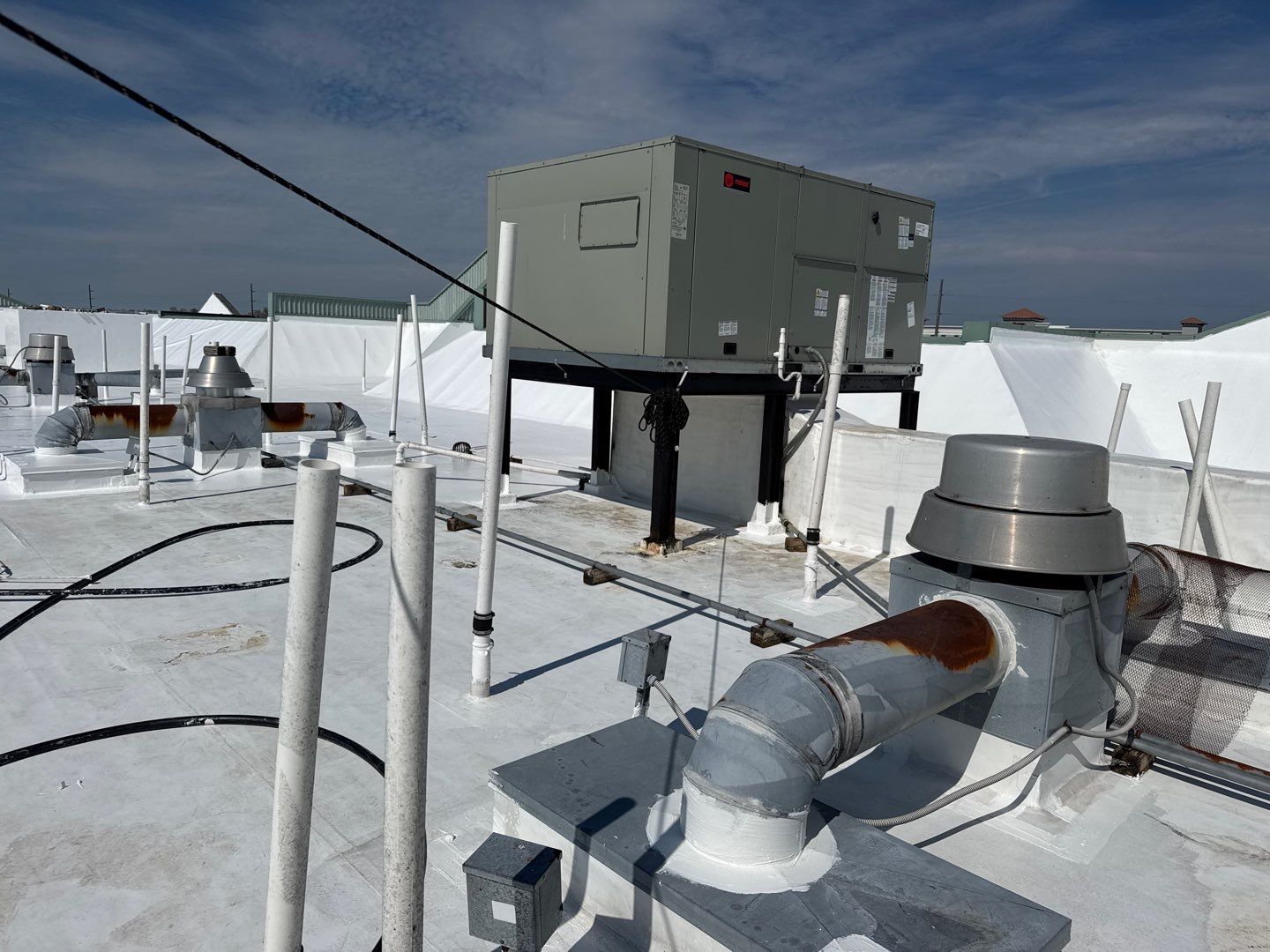 Commercial White Silicone Roof Coating for Hotel in Oldsmar by CES Roofing