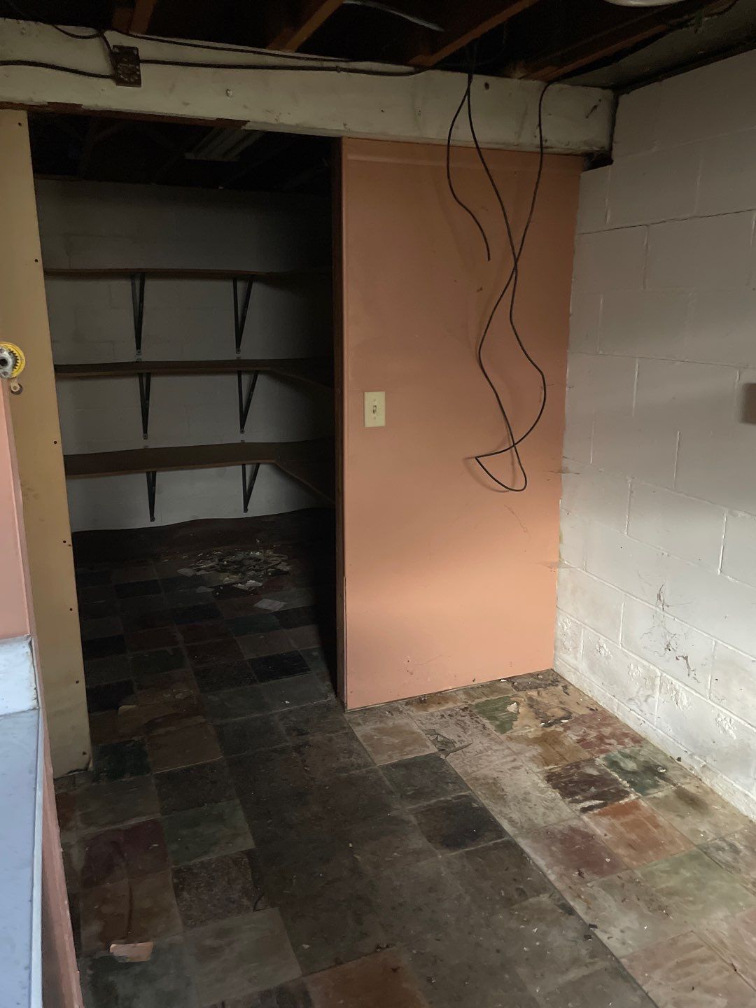 Interior drain tile system installation by ACE Waterproofing & Basement Solutions