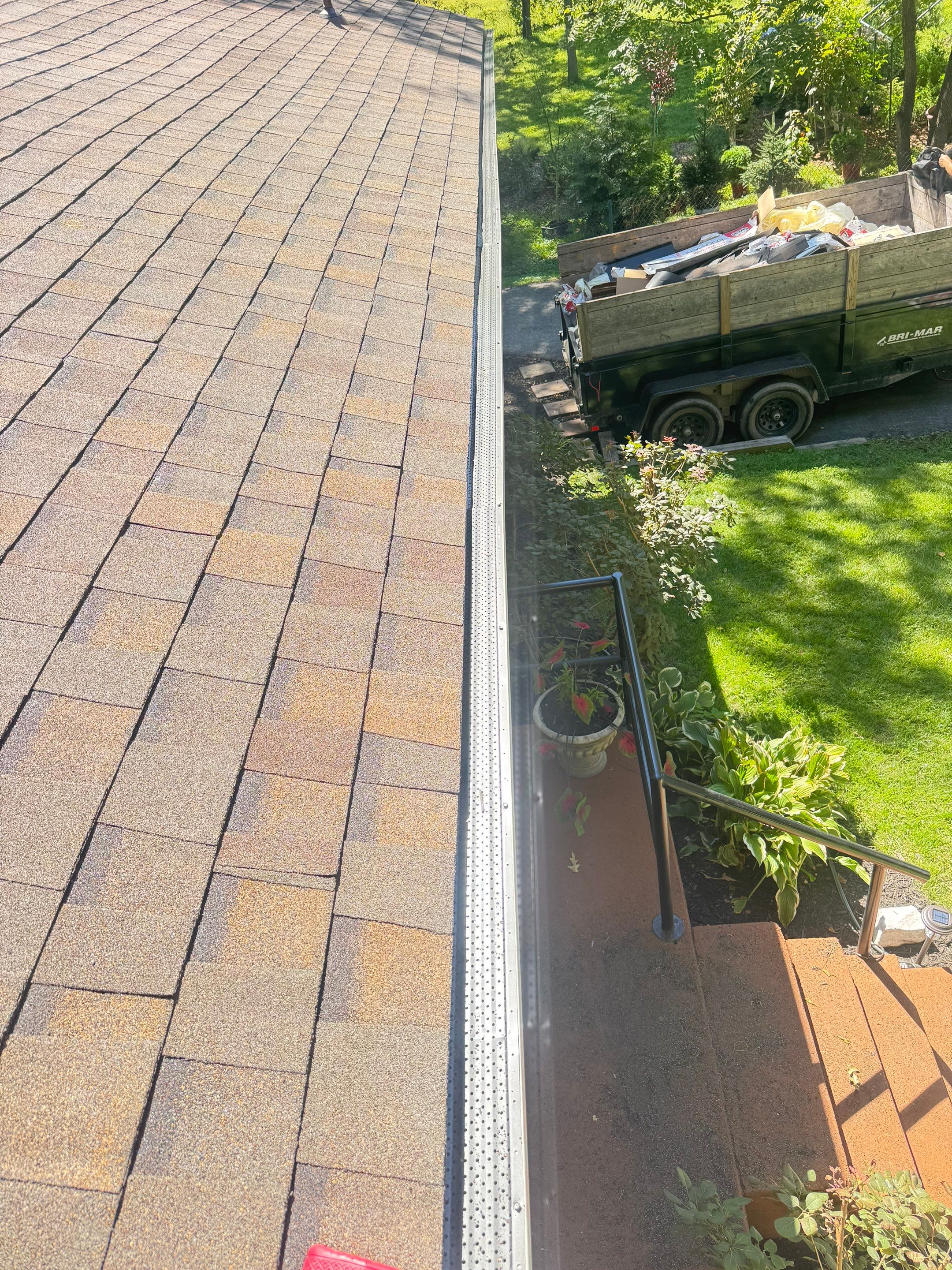 Full Roof Replacement and Gutter Guard Installation in Pasadena, Maryland by First Chesapeake Roofing