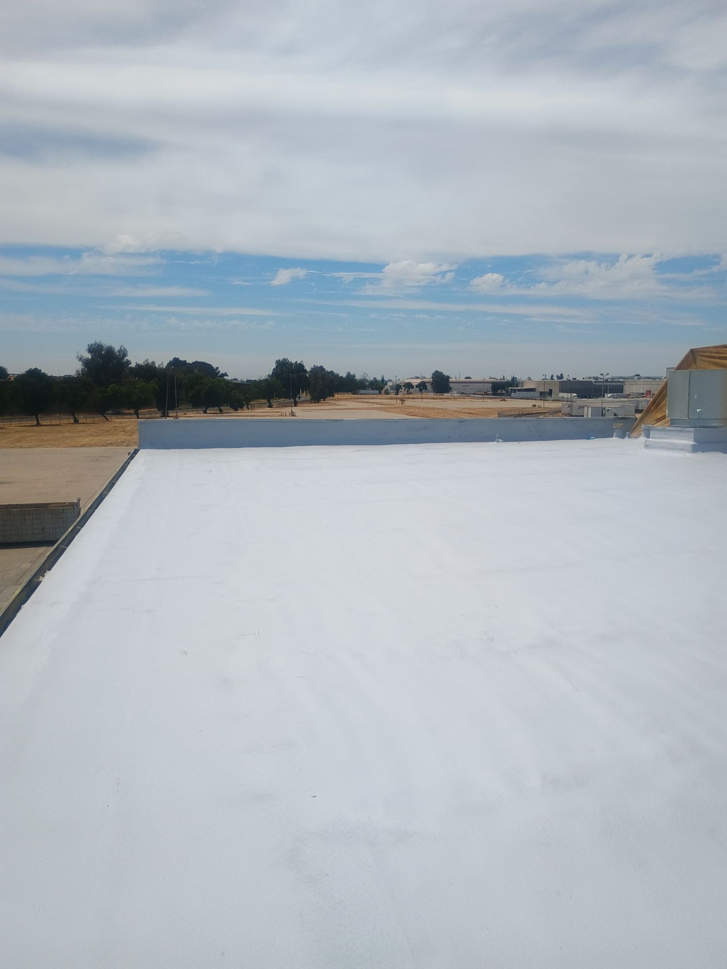 Pro Farms Spray foam roofing project by Straight Edge Roofing Inc