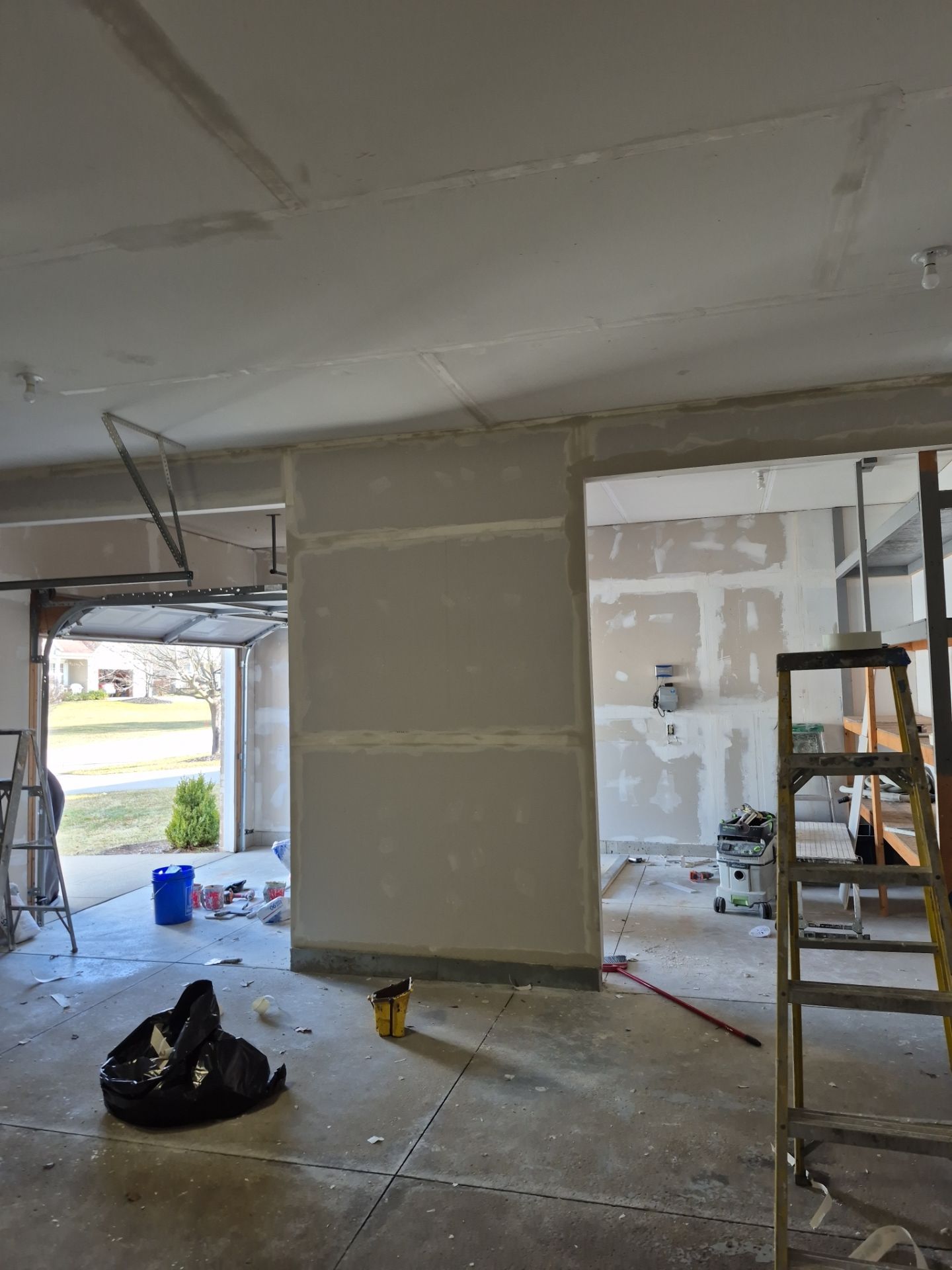 Custom Epoxy Flake Floor and Garage Wall Renovation in Ada by Gordon Painting