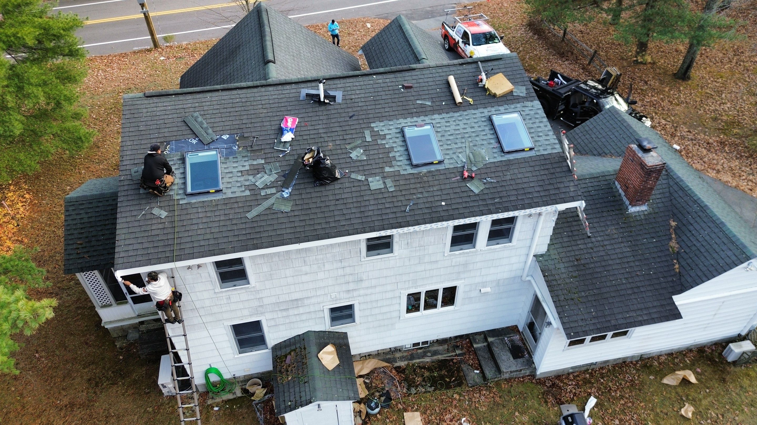 Chelmsford Triple Skylight Leak Repair with Fascia & Shingle Restoration by Mighty Dog Roofing of Greater Middlesex County