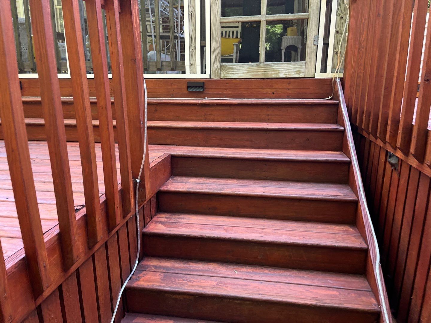 Triple deck re-staining by AKK Painting LLC