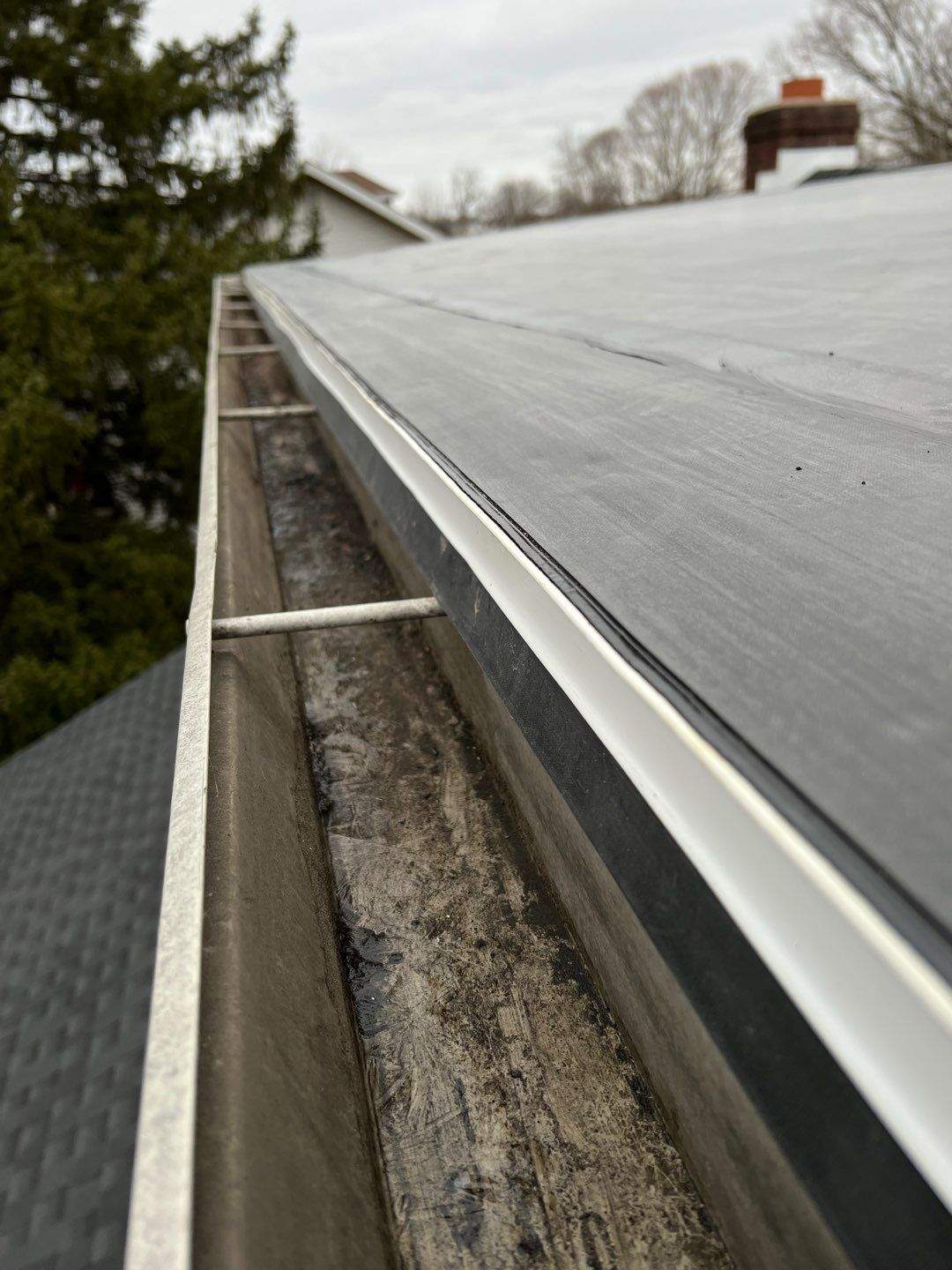 Residential Roofing Installation using 60 mil rubber roof by Nitro Roofing and Construction
