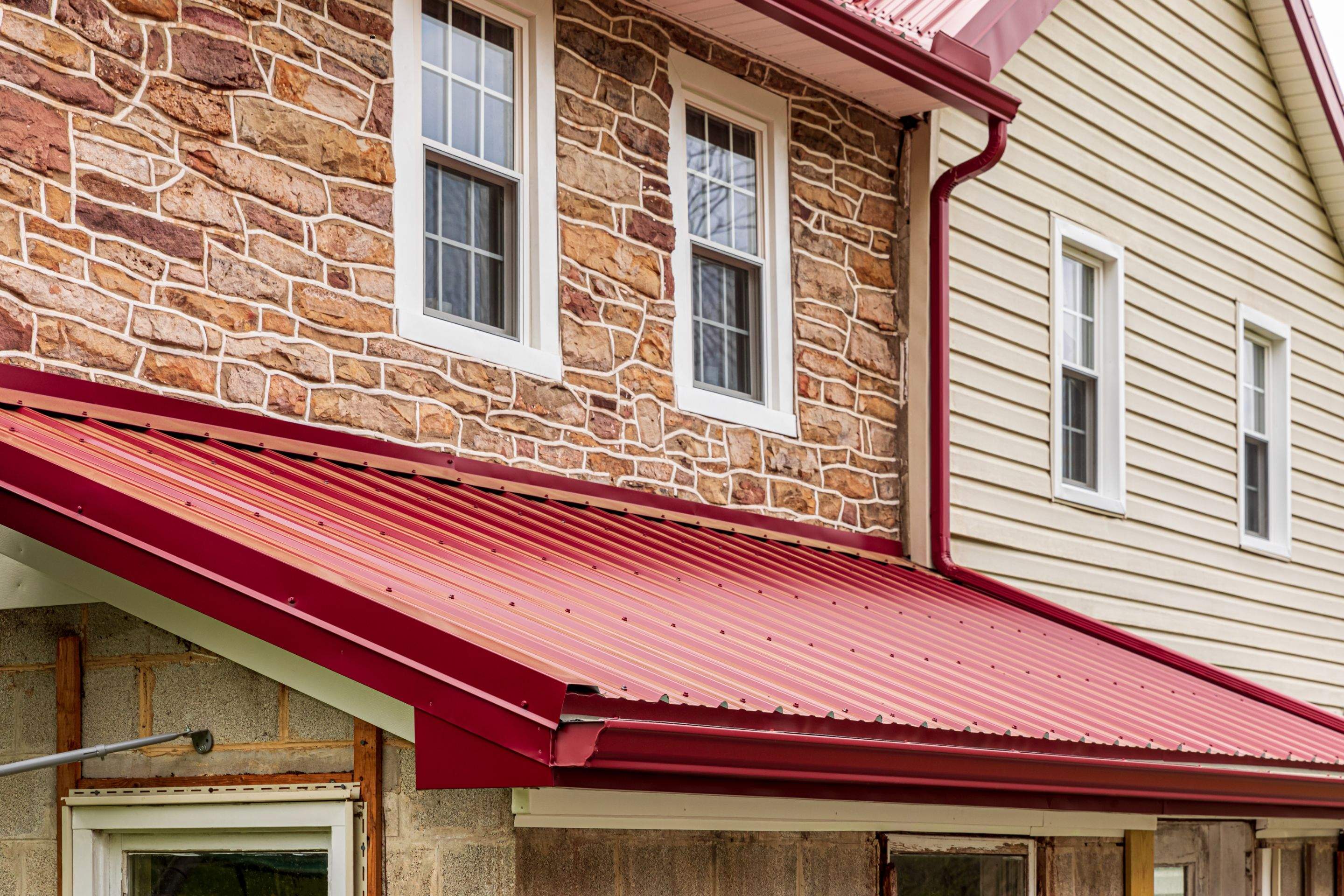 Metal Roof-coloniel red- and new siding by Esh Builders