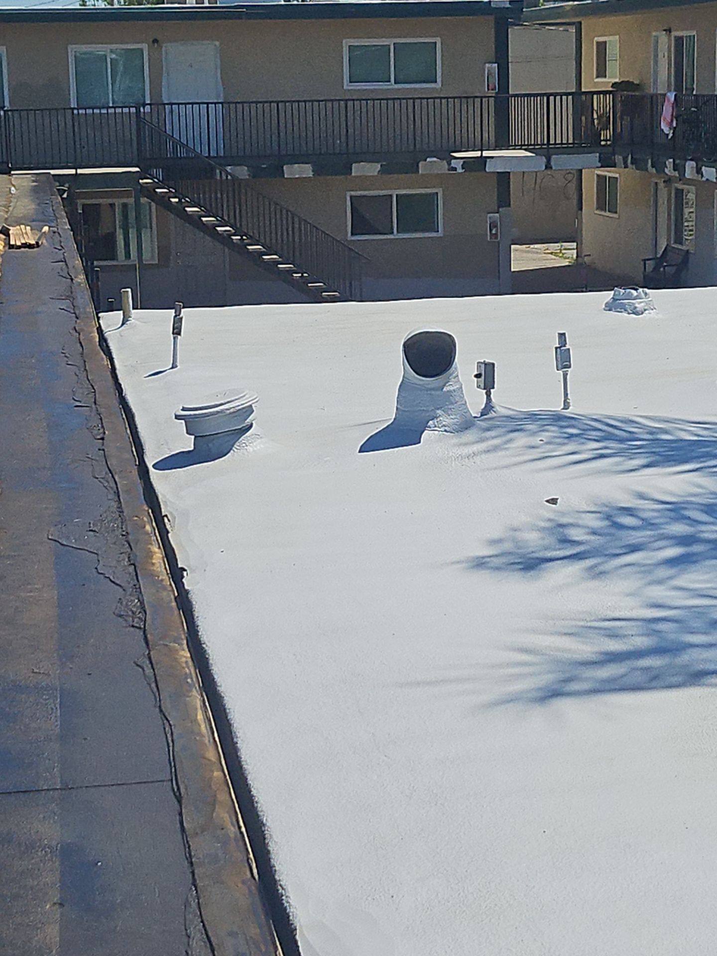 Foam Refurbish using General Coatings acrylic coatings and spray foam by Straight Edge Roofing Inc