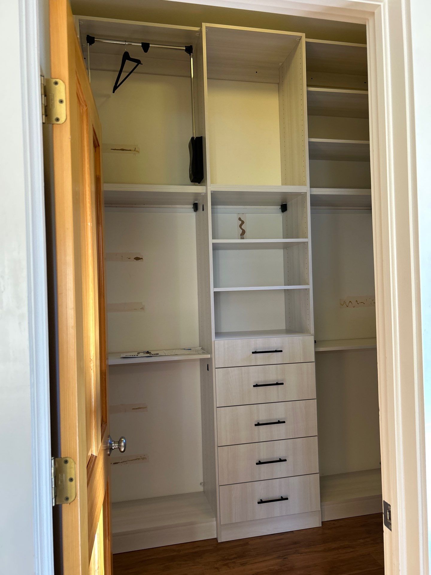 Walk-in Closet in a Small Space by Concept 32, Inc.